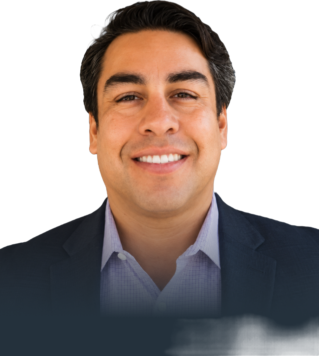 Albert Garcia, smiling, in a navy blazer